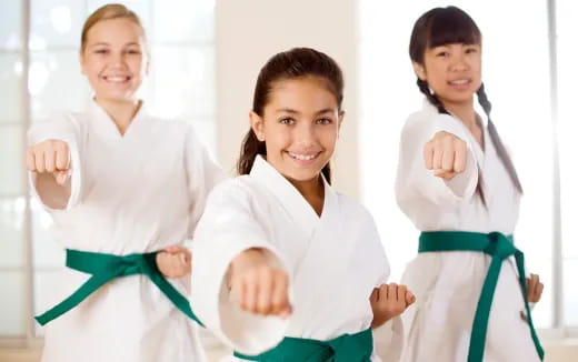 a group of women in white lab coats