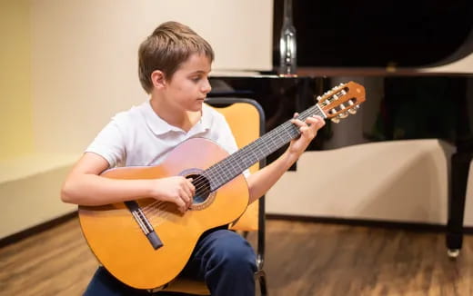 a person playing a guitar