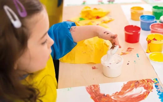a young girl painting