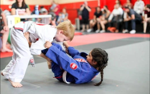 a couple of people in a karate uniform