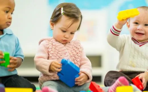 a group of children playing with toys