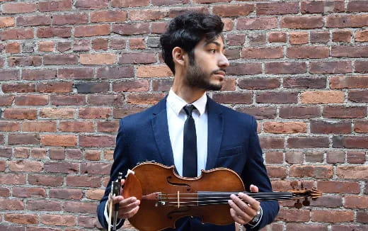 a man playing a violin