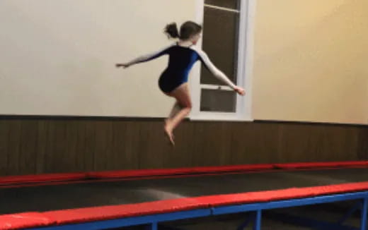 a girl jumping in the air
