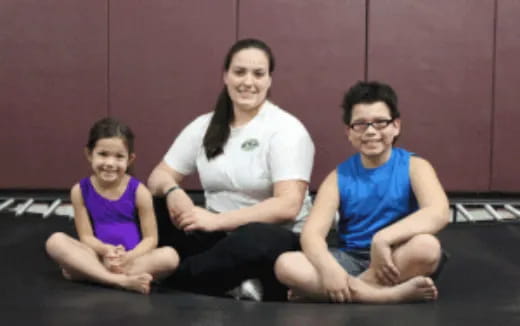 a group of people sitting on the floor