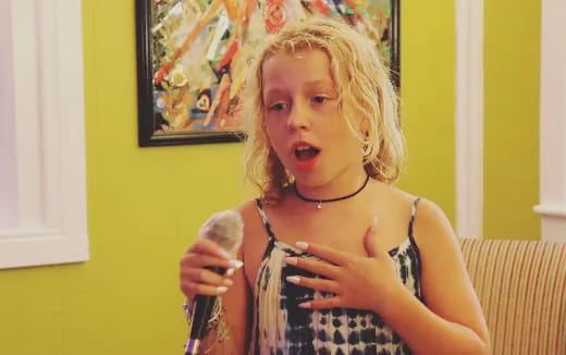 a person holding a microphone