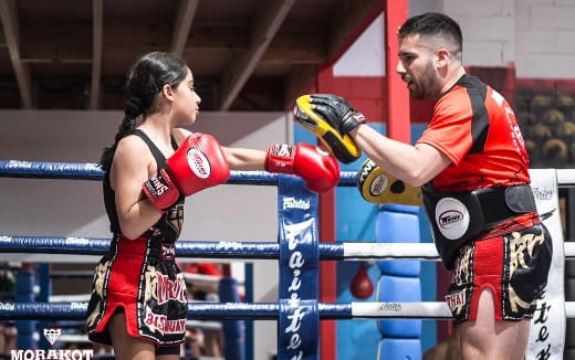 a man and woman in boxing gloves