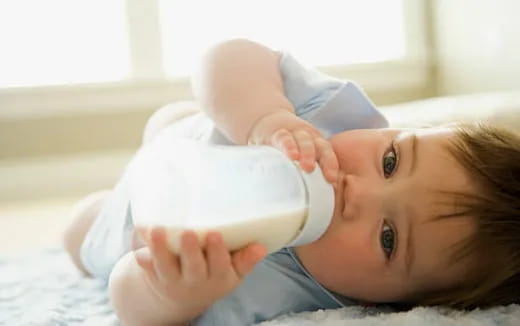 a baby in a white shirt