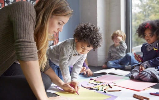 a woman and a child sitting at a table