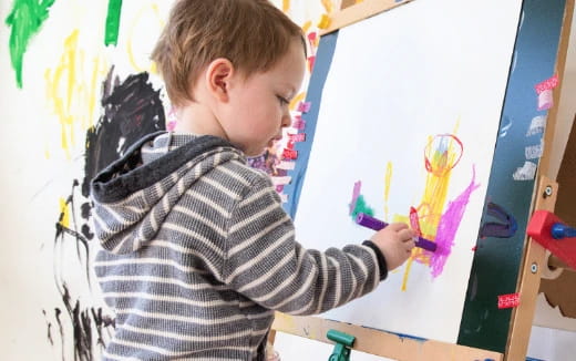 a young boy painting