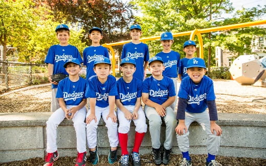 a group of kids in blue uniforms