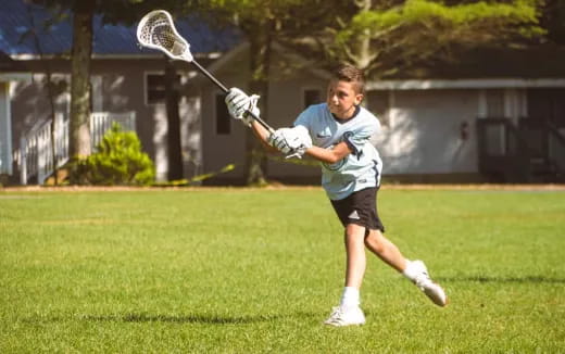 a person playing lacrosse