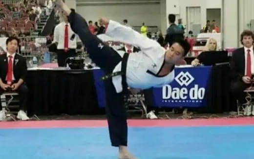 a person doing a handstand on a mat