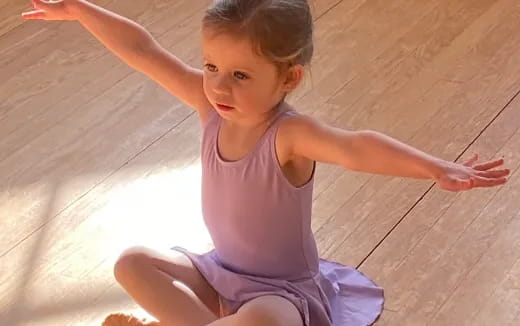 a girl on a wooden floor