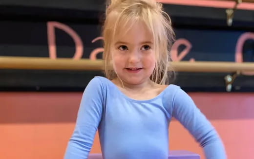 a girl in a blue dress