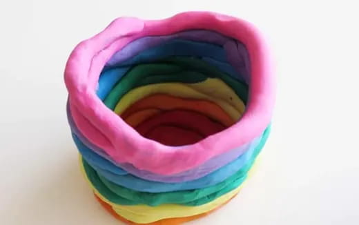 a close up of a rainbow colored hat