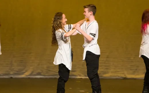 a man and woman dancing