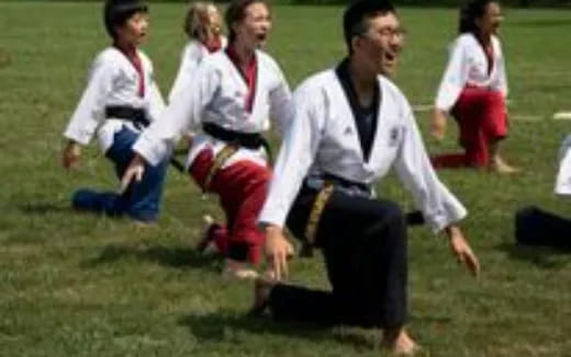 a group of people in karate uniforms
