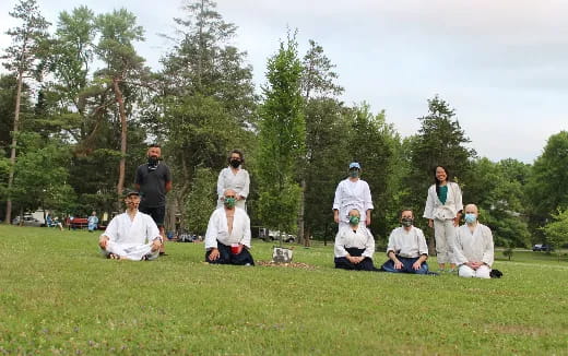 a group of people in white robes
