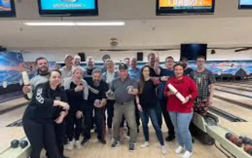 a group of people posing for a photo