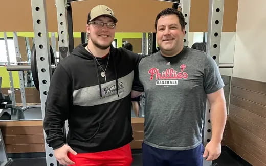 two men standing next to each other