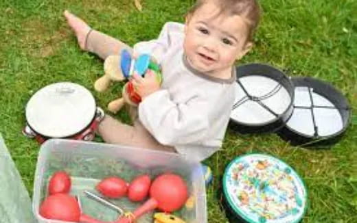 a baby playing with a toy