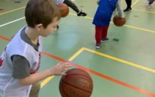 a boy holding a basketball