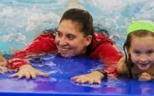 a man and a woman in a pool