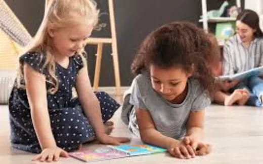 a few children sitting on the floor