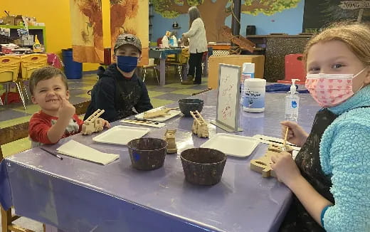 a group of children painting