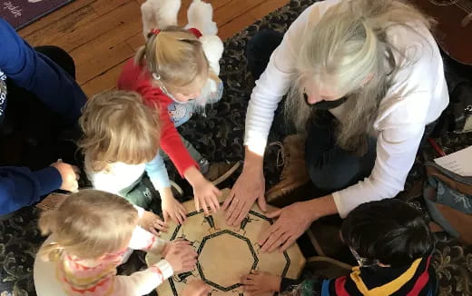 a person helping a group of children