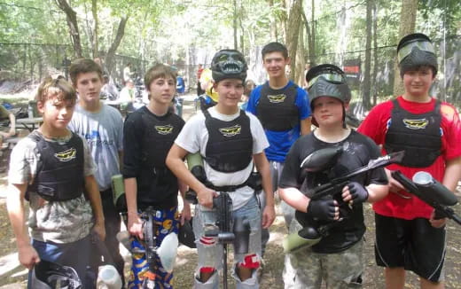a group of boys holding guns