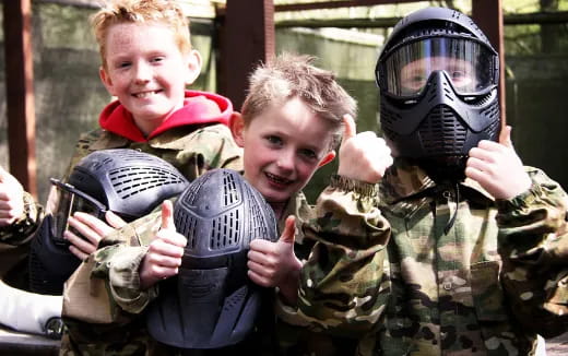 a group of kids holding guns