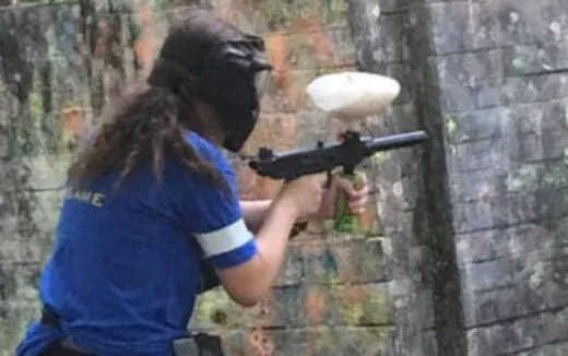 a person shooting a gun