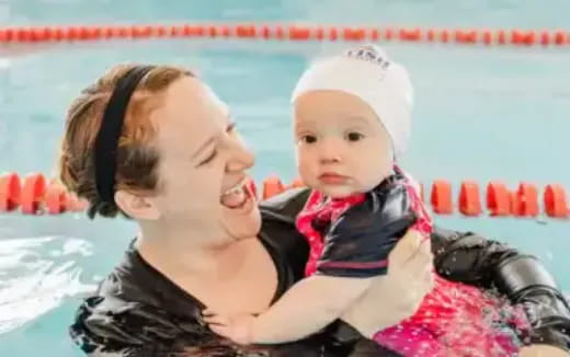 a person holding a baby