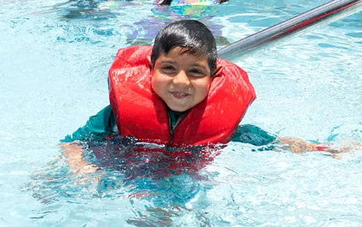 a boy in a pool