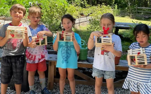 a group of children holding books