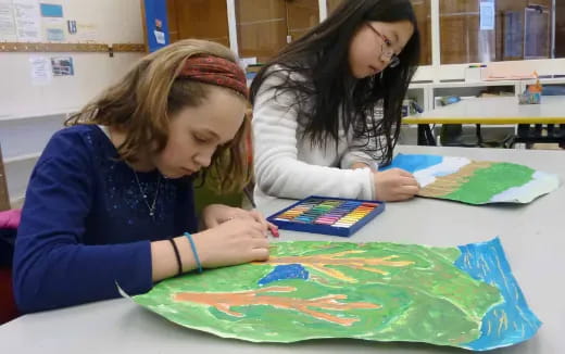 a few young girls painting