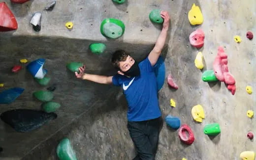 a person climbing a rock wall