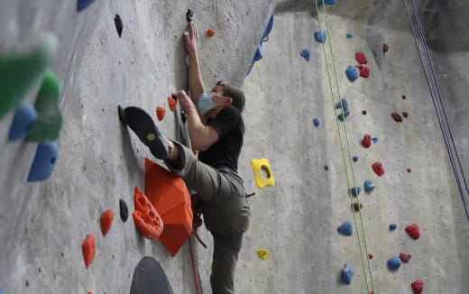 a man climbing a rock wall