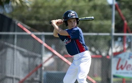 a young boy playing baseball