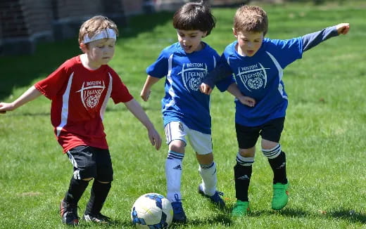 kids playing football on a field