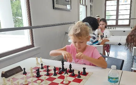 a girl playing chess