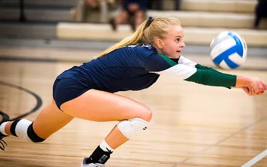 a woman playing volleyball