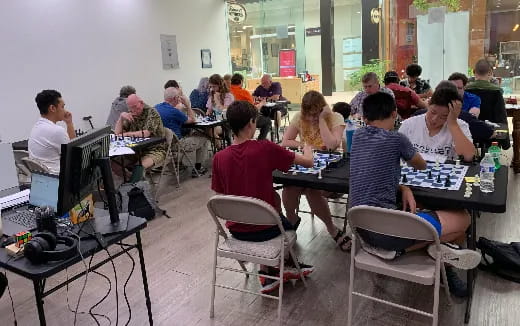a group of people sitting at tables