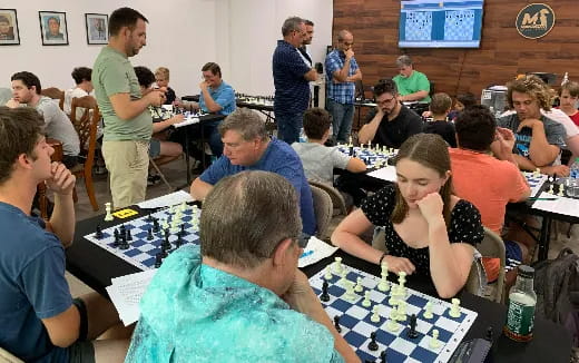 a group of people sitting at tables