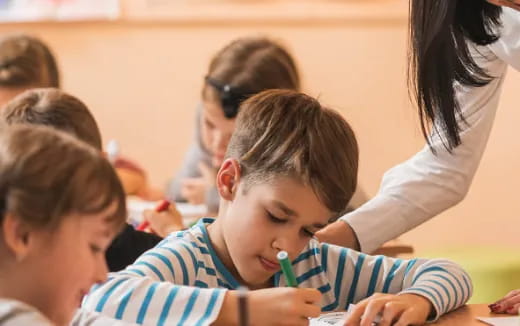 a teacher helping a student