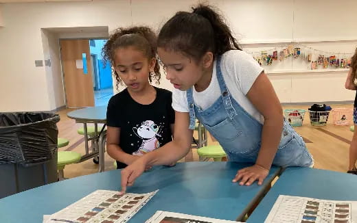 a person and a child looking at a map