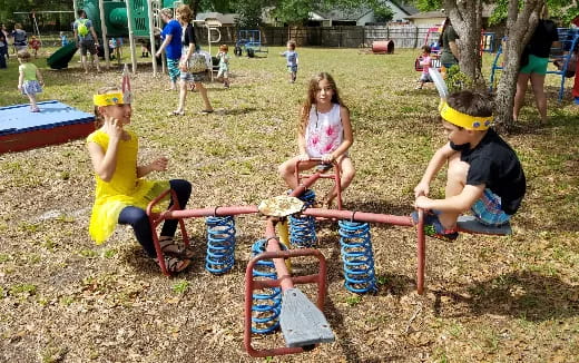 children playing in the grass
