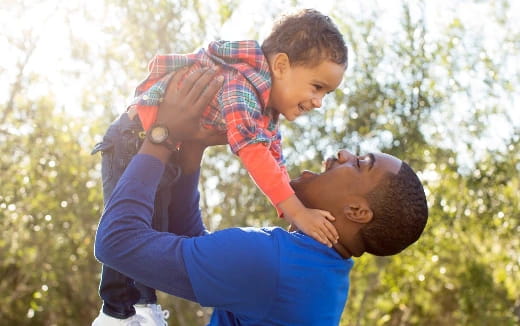 a person carrying a child