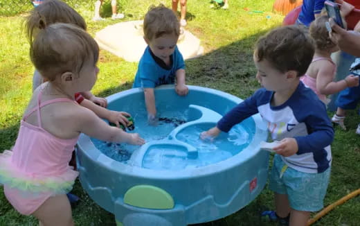 children playing in a pool